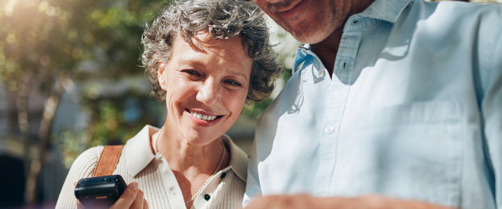 A middle-aged couple looking at a map