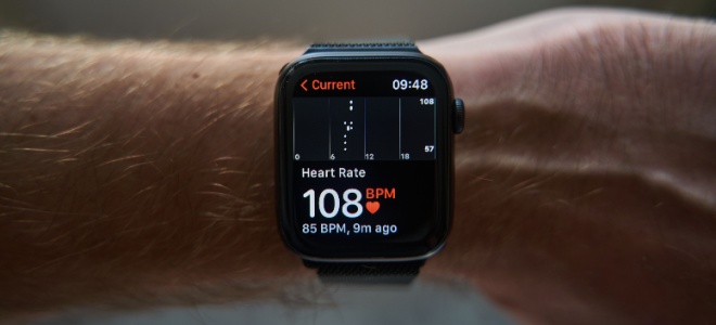 A smart watch showing a heart rate