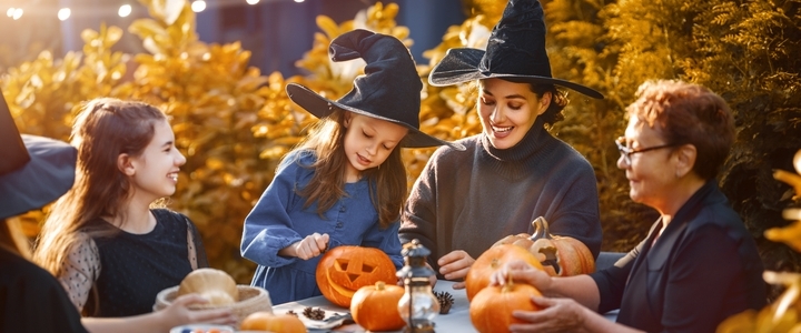 A family carving pumpkins.